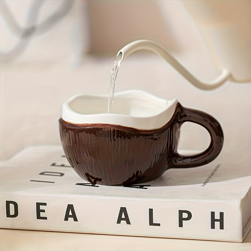 A Ceramic Coffee Mug Designed Like a Coconut Shell, Complete with a Spoon. This Novelty Tropical Mug Is Perfect for Afternoon Tea, Yogurt, And Fruit. It Is Safe for Both The Dishwasher And Microwave