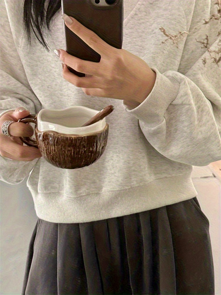 A Ceramic Coffee Mug Designed Like a Coconut Shell, Complete with a Spoon. This Novelty Tropical Mug Is Perfect for Afternoon Tea, Yogurt, And Fruit. It Is Safe for Both The Dishwasher And Microwave